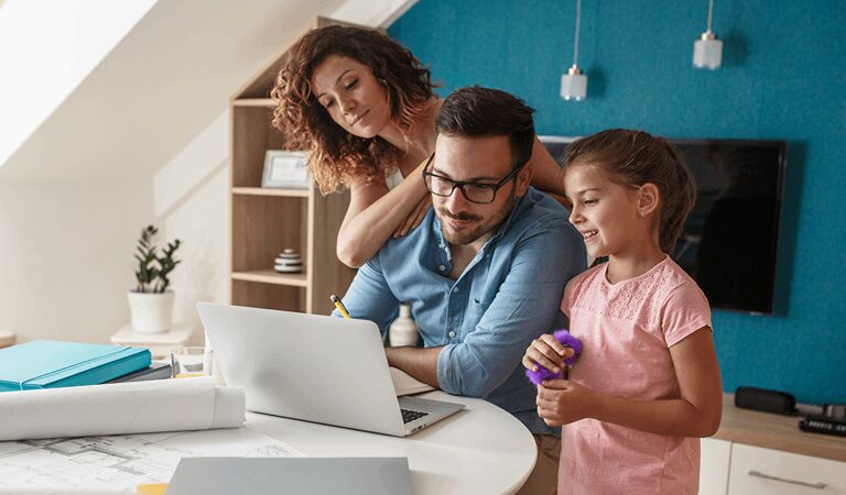 Family working together on a laptop.